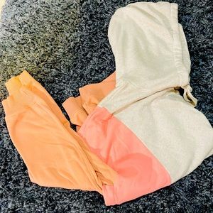 American Eagle “Ahh-mazingly” soft “jegging fit” pink block hooded sweatshirt.
